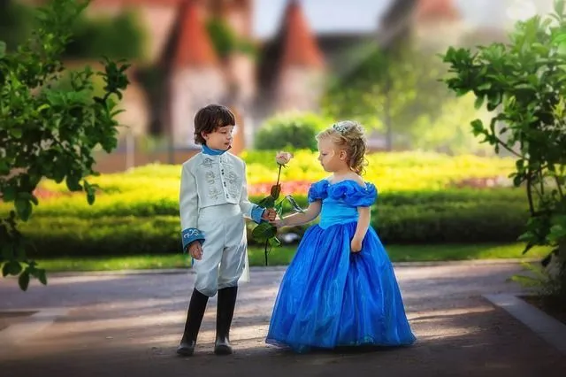 A little boy and girl dressed as prince and princess 