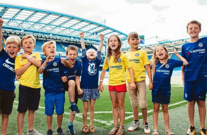 Kids cheering at the Chelsea Stadium