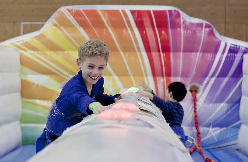Boy at inflatable castle smiling