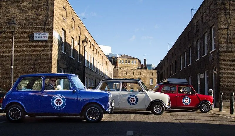 Restored Classic Mini Coopers with Small Car Big City