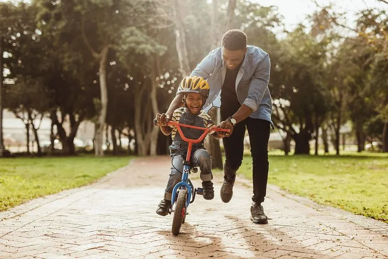 Parent and child bike riding