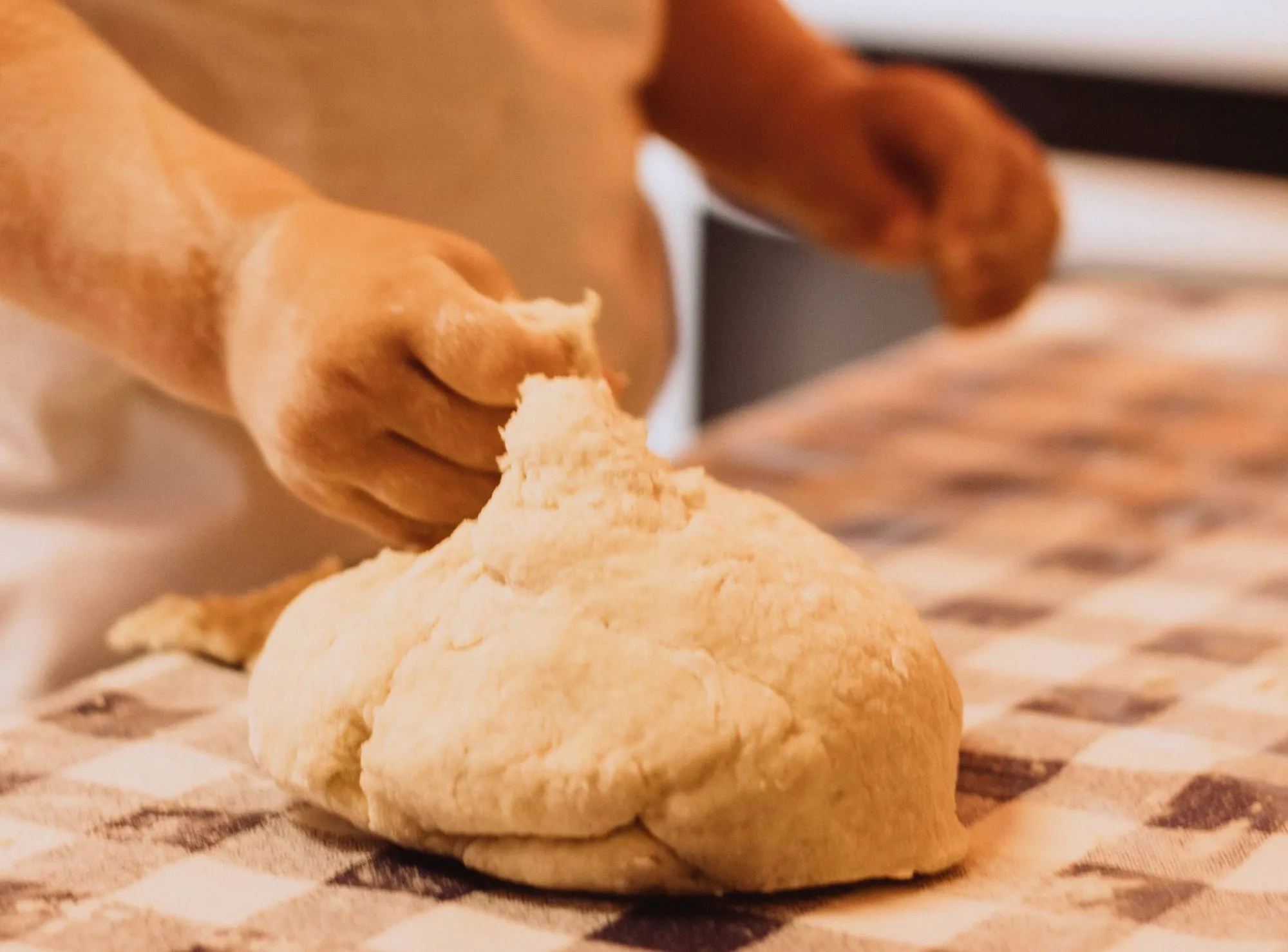 child handling dough