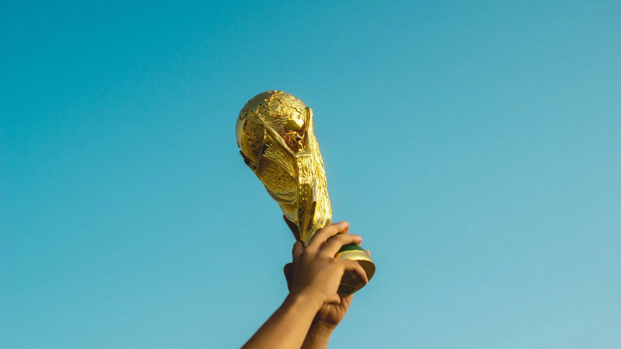 holding up the World Cup trophy