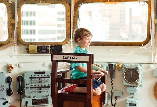 boy on HMS belfast ship fun boat and water activity for kids