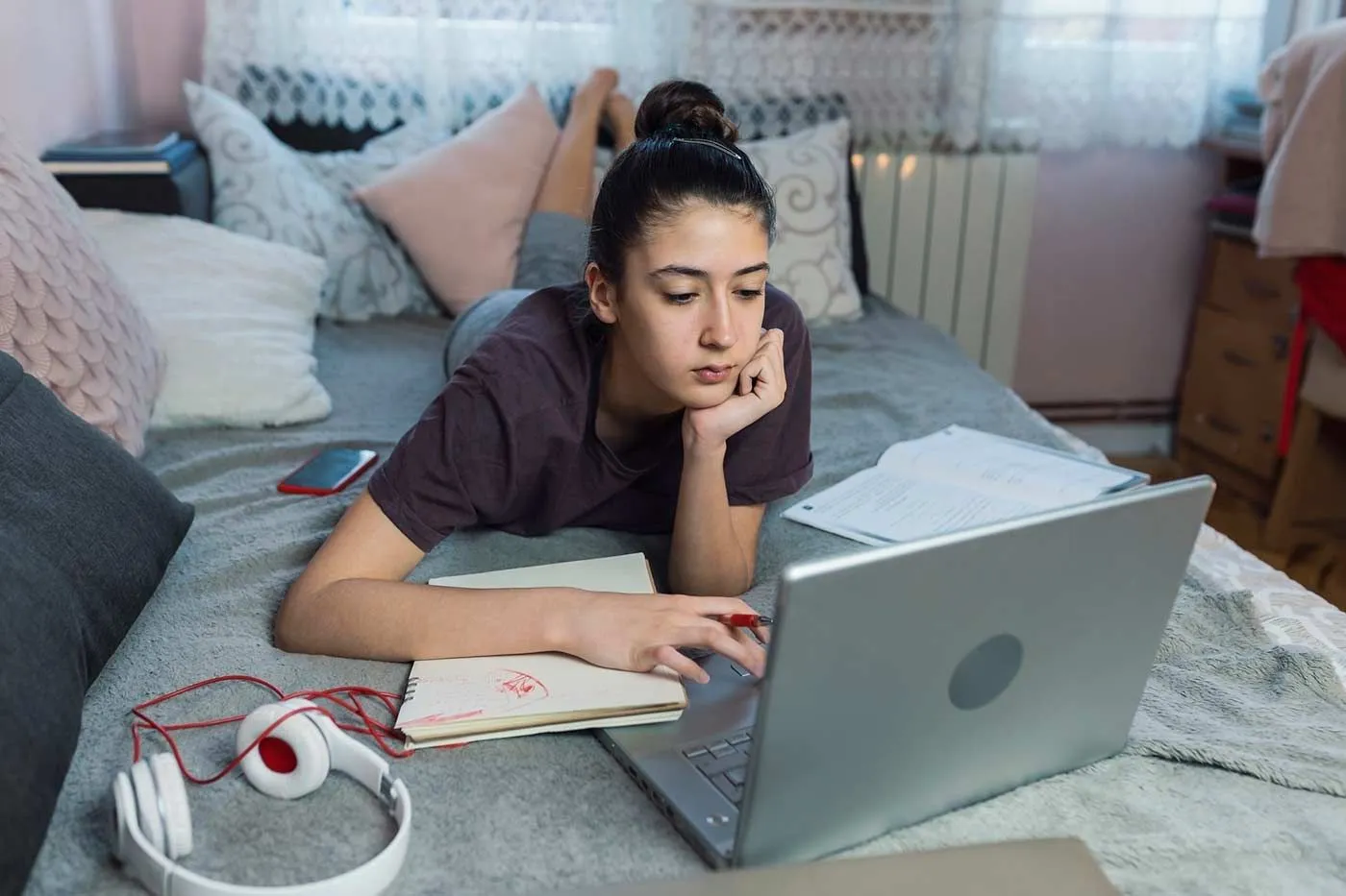 A key stage 4 girl on her laptop. Image