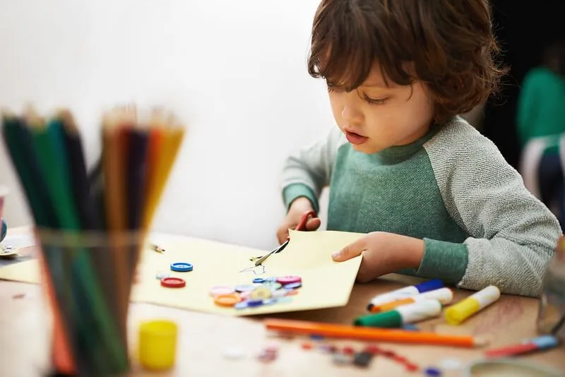 Child creating a paper maze activity