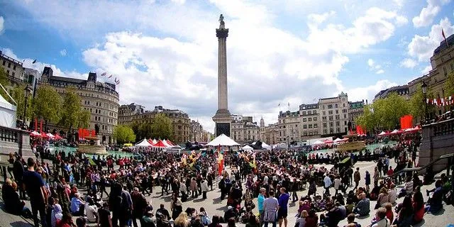 View of Trafalgar Square with market stalls and people