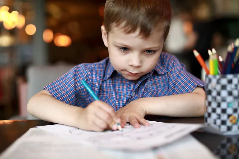 Child doing art.