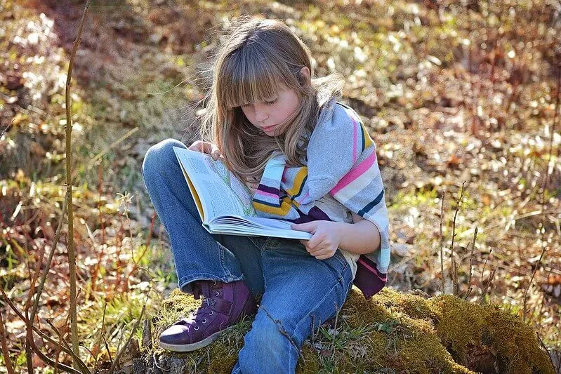 girl reading roald dahl novel