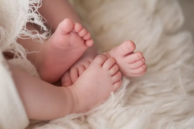 Feet of twins with perfectly matched baby names