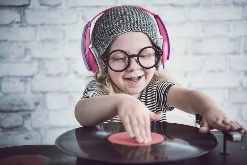 A little girl cosplaying as a DJ