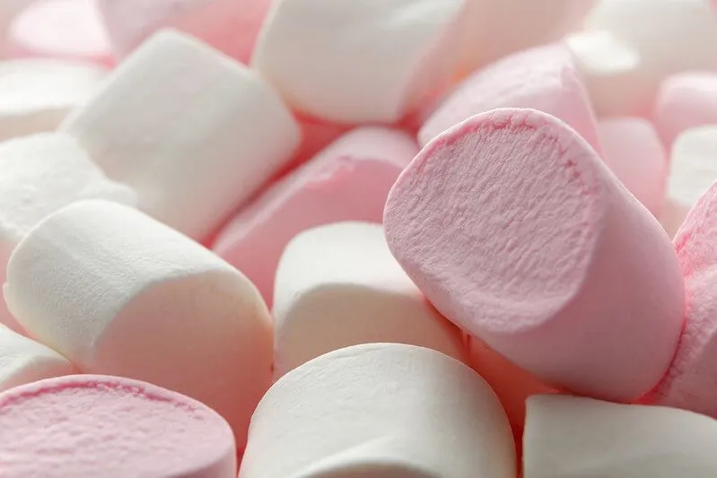 Pile of pink and white jump marshmallows.