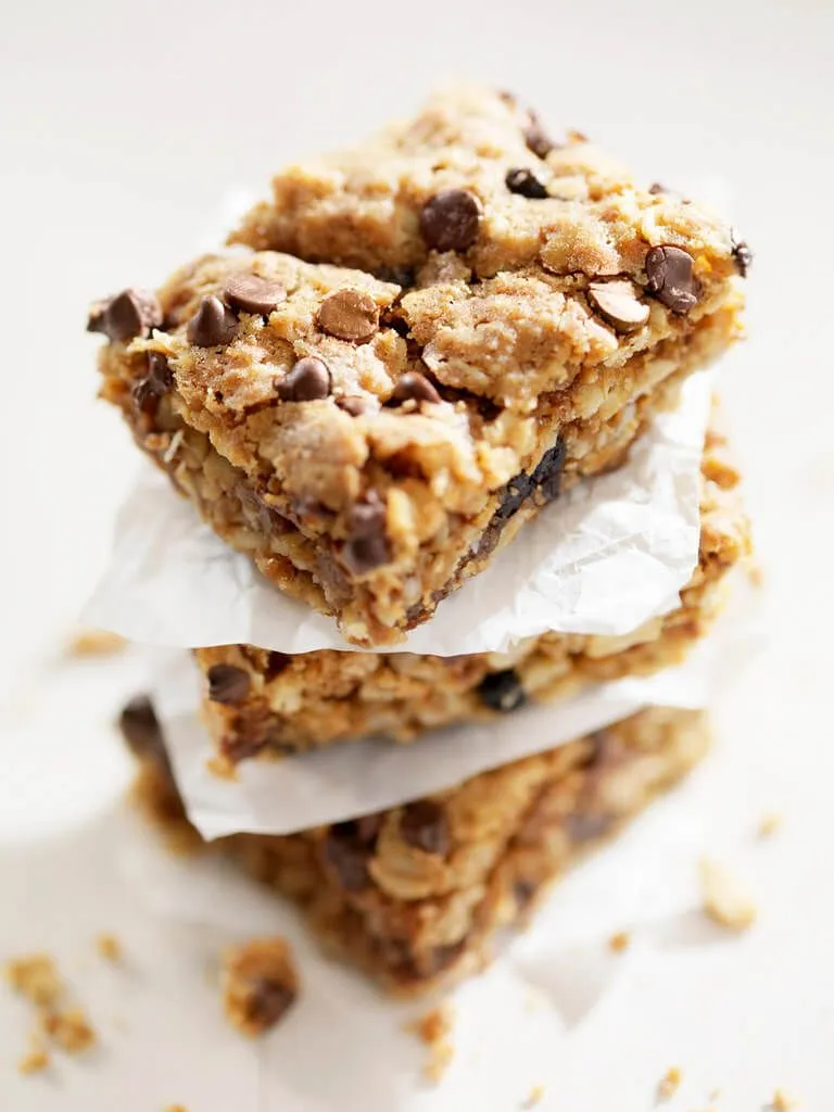 Chocolate chip flapjacks stacked on top of each other.