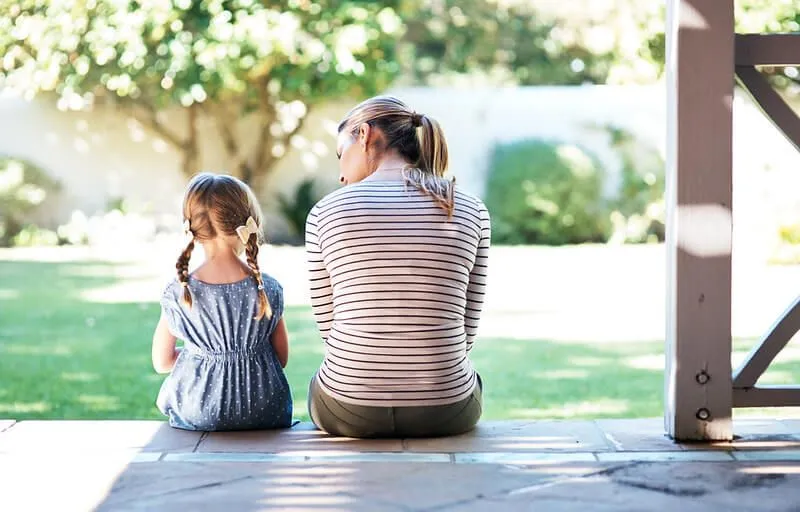 Parent and child resolving family conflict
