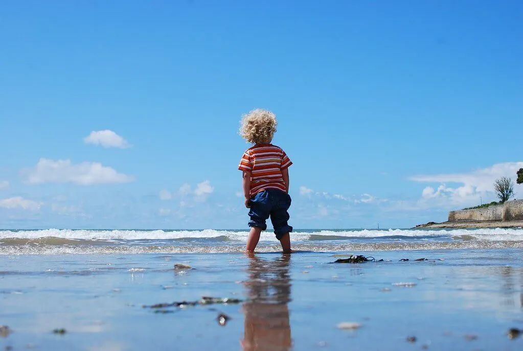 kid on beach north west england