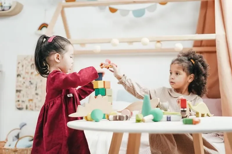 Children making a block counting tower, great block activities for preschool kids