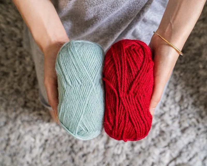 Teens holding balls of wool for knit, crochet kids tips