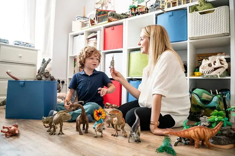 Mum and son playing with the best dinosaur gifts for kids and teens