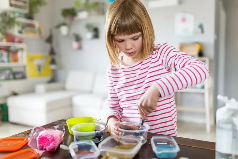 Little girl doing is yeast alive experiment