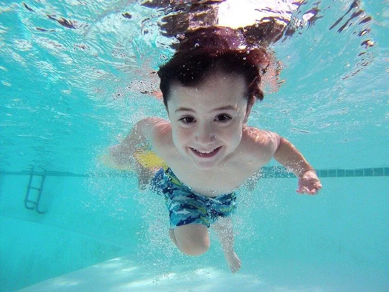 Boy swimming during the new normal