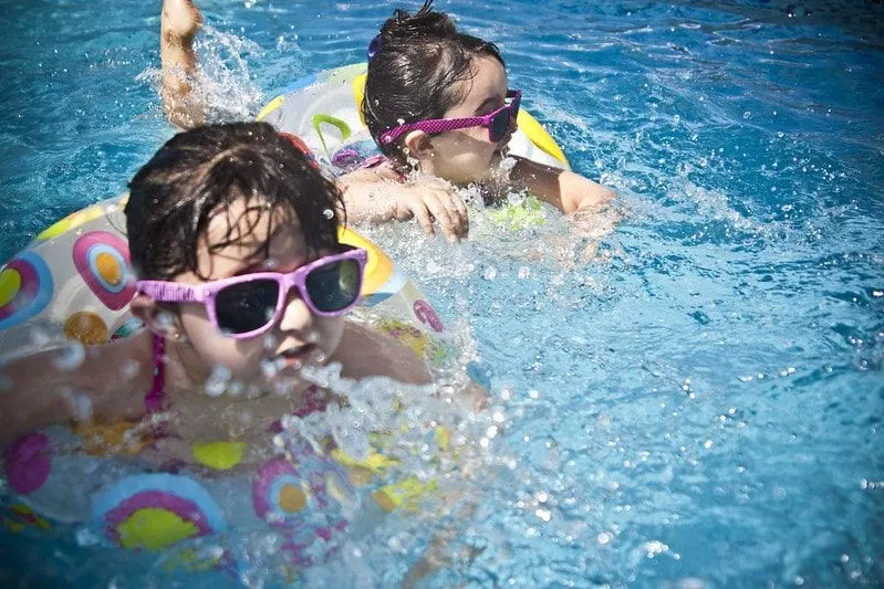 Keep a paddling pool clean so your kids can swim around like these two little girls in their inflatables.