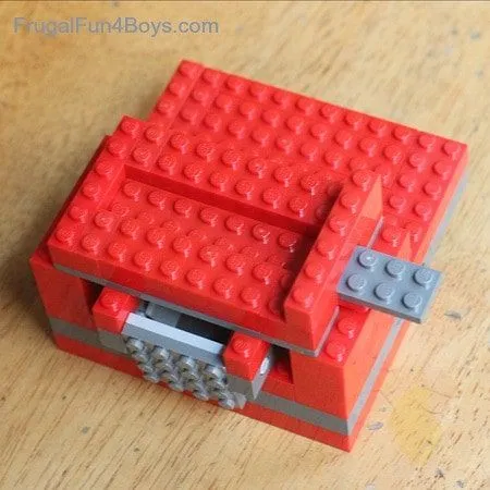 Check the sliding arm of your lego candy dispenser.