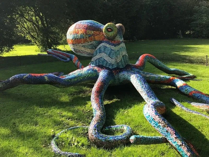 large colourful octapus sculpture in a park