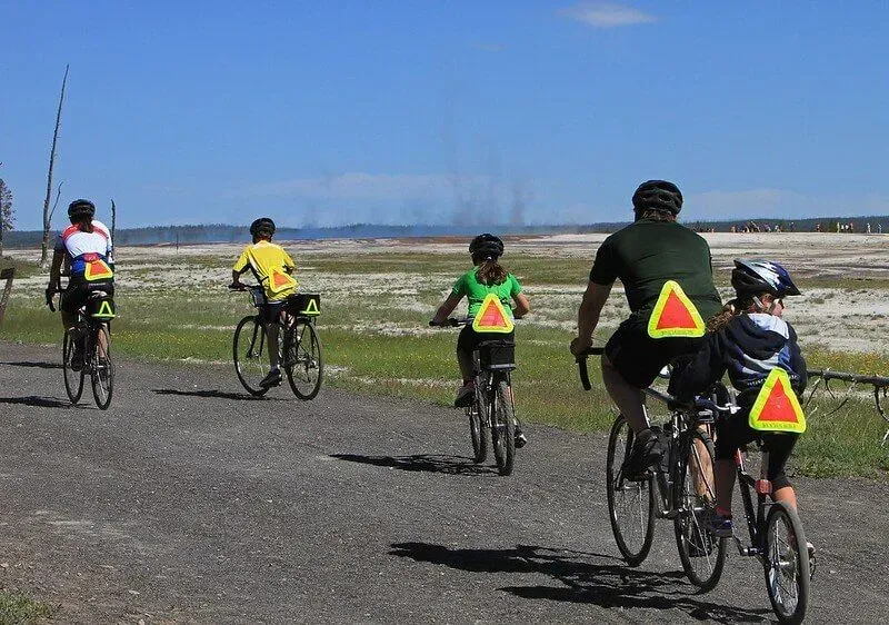 family cycling along coastal path