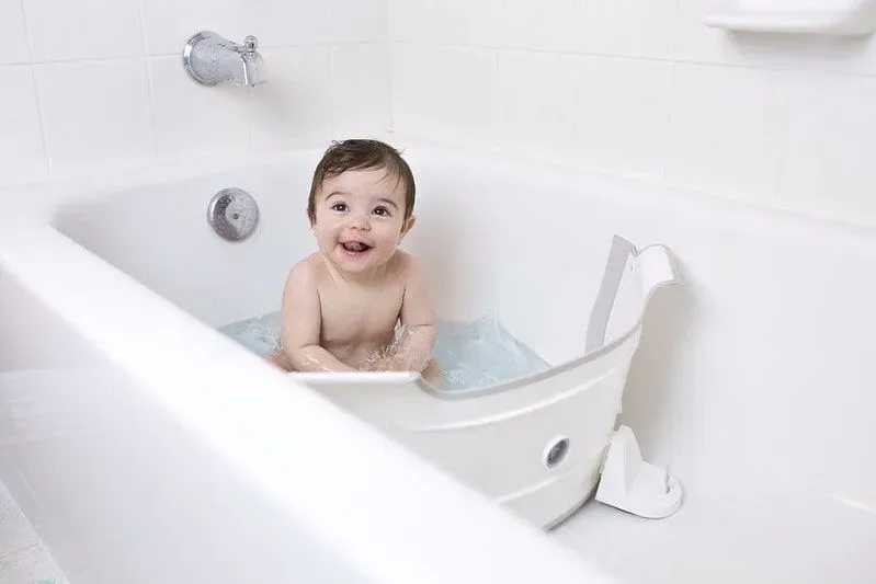 Baby enjoying his baby bath support in his bath