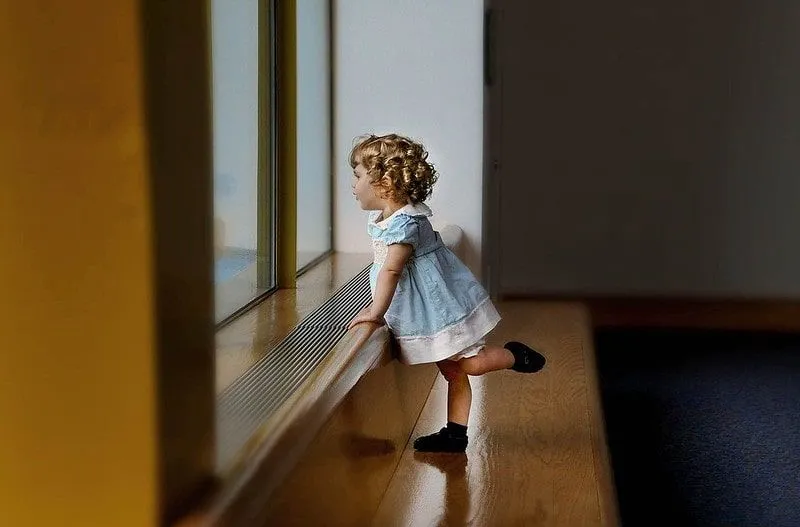 Girl in a white and blue dress with a girls' name beginning with E