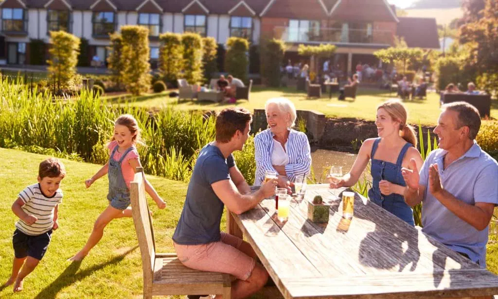 Family enjoying outdoors at child-friendly pub.