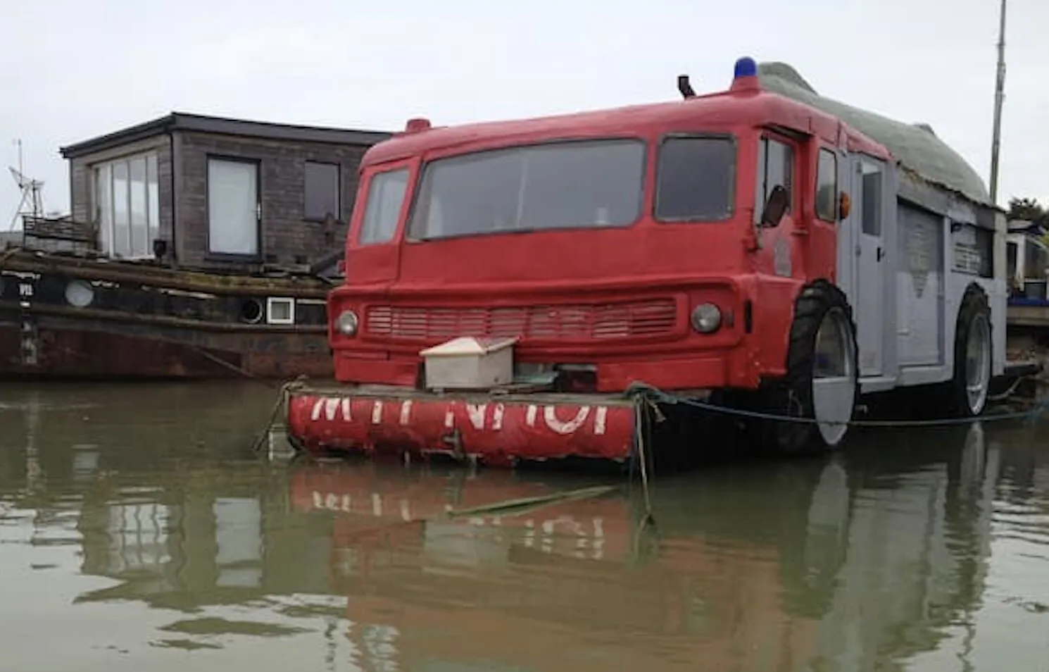 Quirky fire engine and upside-down boat at The Dodge Fire Engine Boat. 