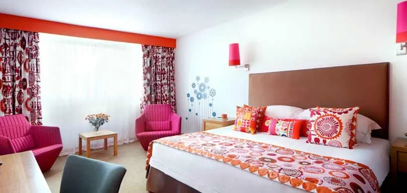 Colourful bedroom decor at family-friendly Bedruthan Hotel and Spa.