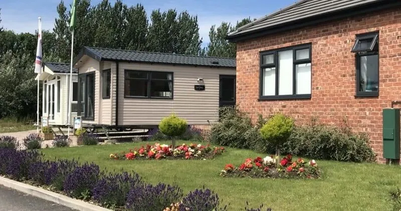 Pretty family lodges with front garden at Piper's Height Caravan Park, Blackpool.