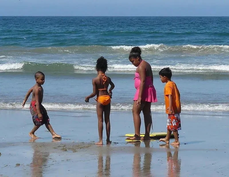 Children having fun playing at the seaside.