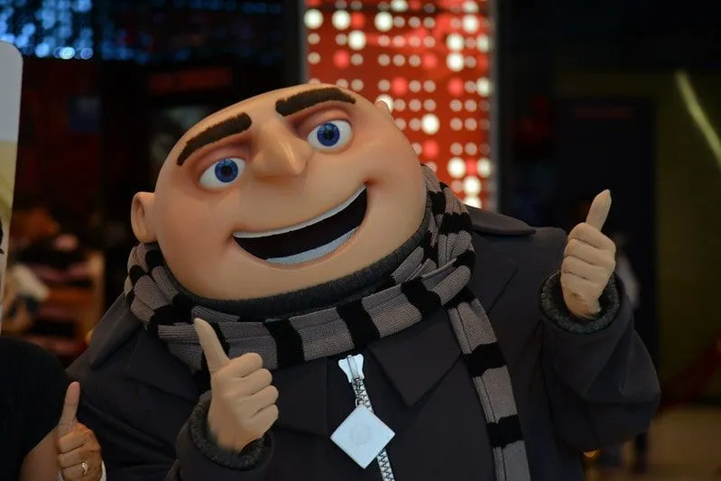 Gru from Despicable Me smiling and giving a thumbs up.