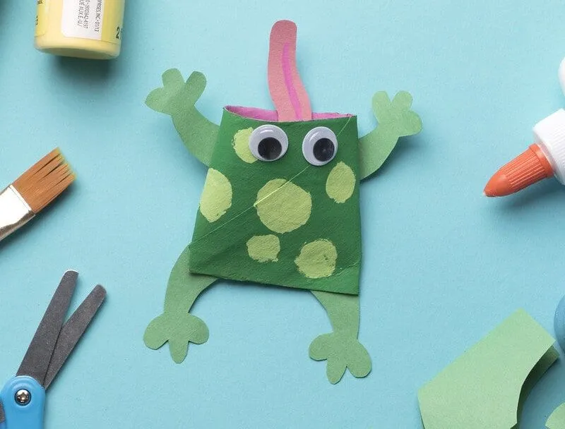 Frog made from a toilet roll and painted green.