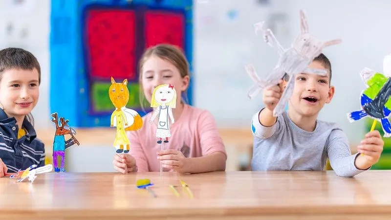 Children Playing In Classroom With Their Own Rag Doll