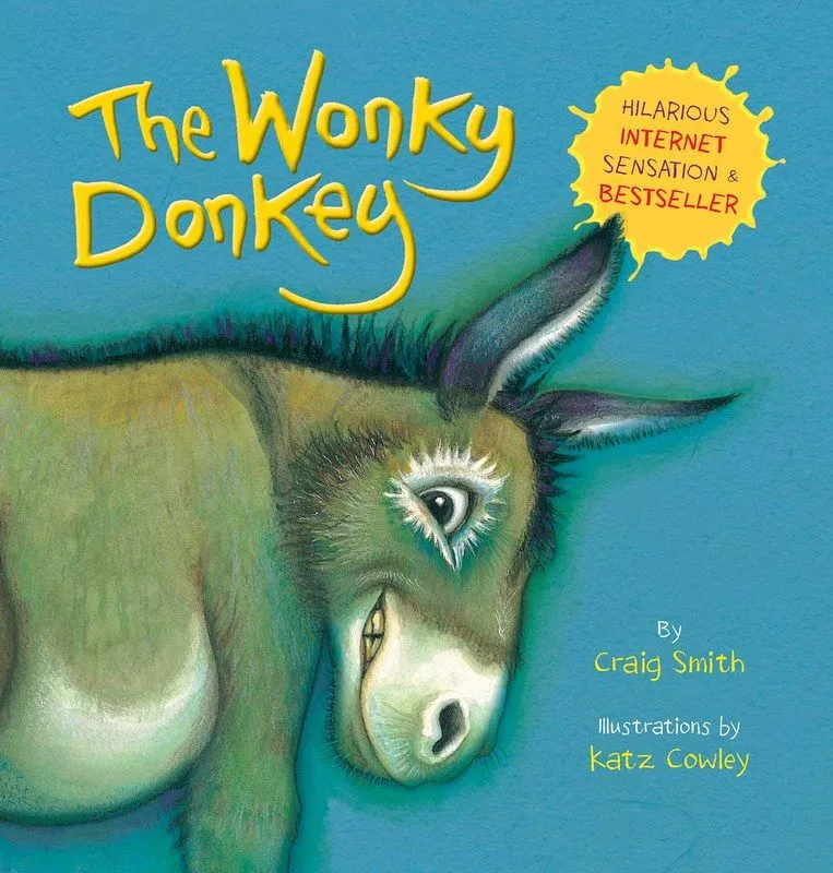 Cover of The Wonky Donkey: a brown donkey is smiling excitedly, against a blue background.