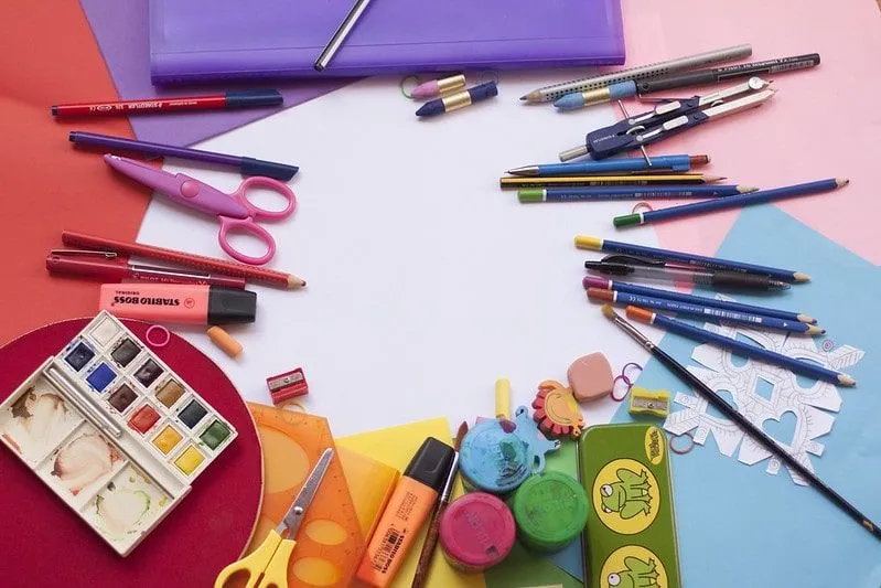 Colourful arts and crafts supplies laid out in a ring on the table.