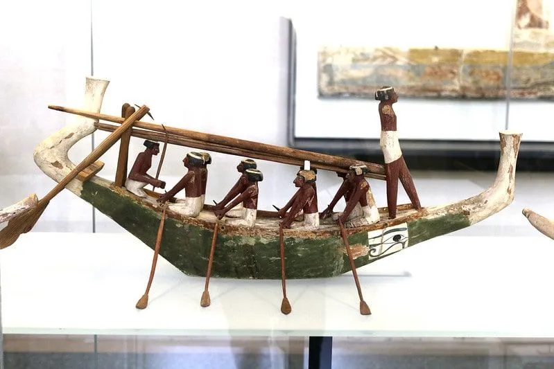 Model of ancient Egyptians on a boat.