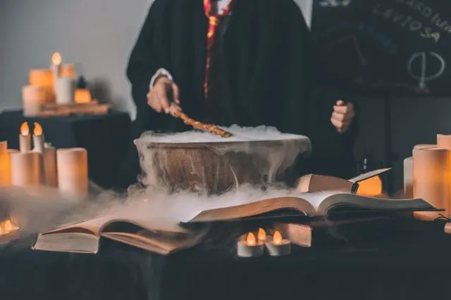 Young wizard making a potion in potions class at Hogwarts.