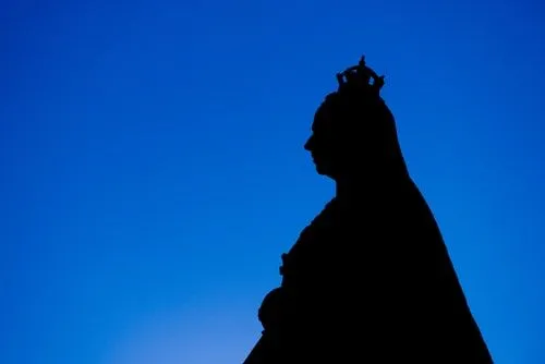 Iconic silhouette of Queen Victoria against a blue background.