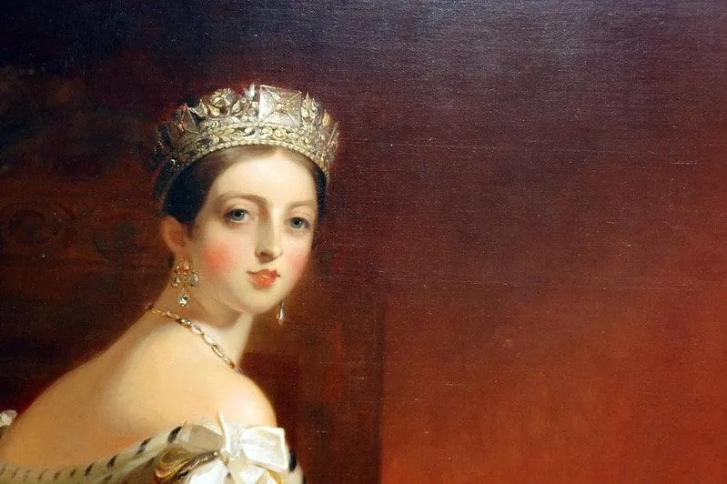Painting of young Victoria wearing a tiara and lavish jewels.