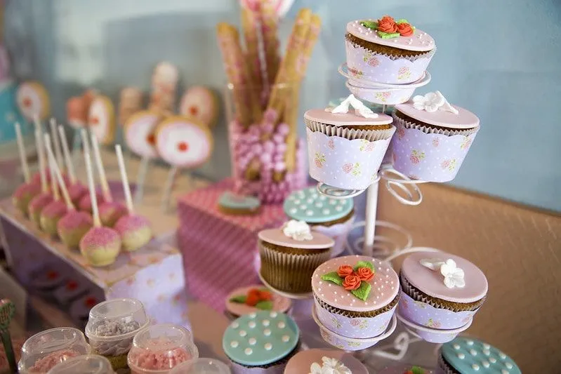 Pretty pink and blue cupcake display table.