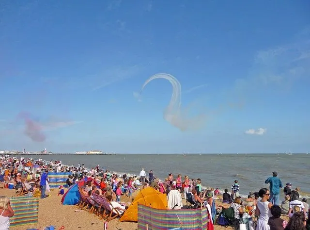 Busy beach at Clacton-on-Sea, everyone enjoying the sunny day.