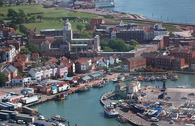 View of Old Portsmouth from above, set on the waterfront with colourful houses.