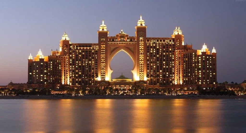 The luxury Atlantis The Palm hotel in Dubai, lit up at night time.