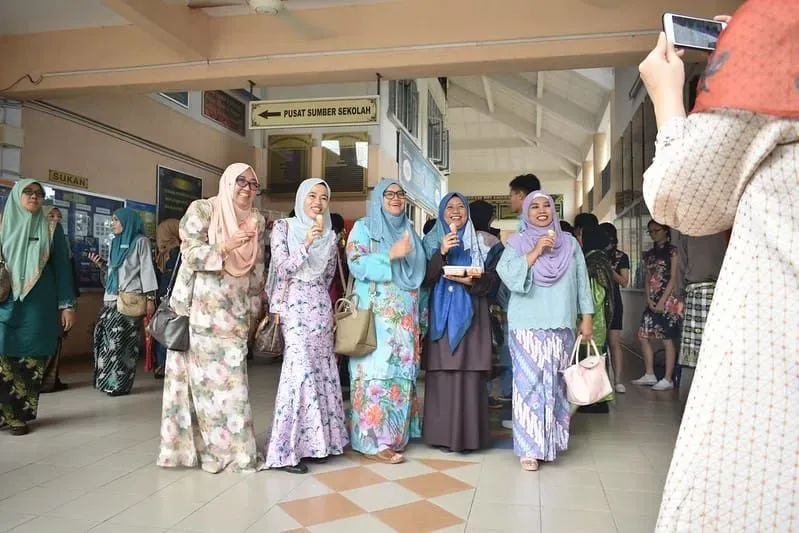 Five women in headscarves in Malaysia, celebrating Eid.