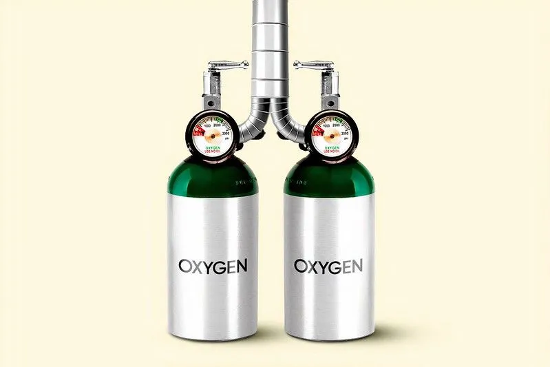 Two oxygen tanks feeding into the same pipe, resembling human lungs. 